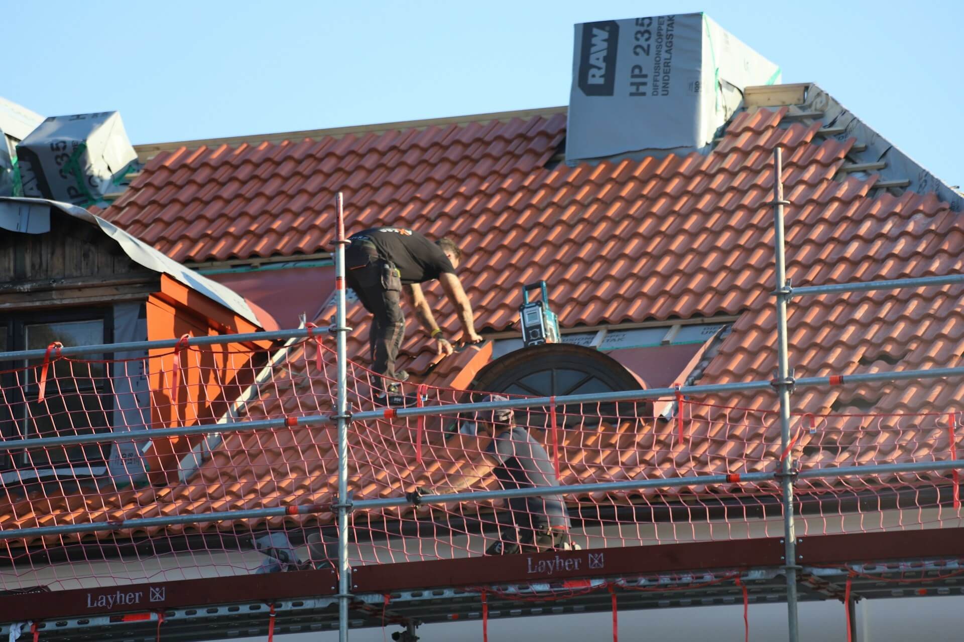 Roofing work with scaffolding
